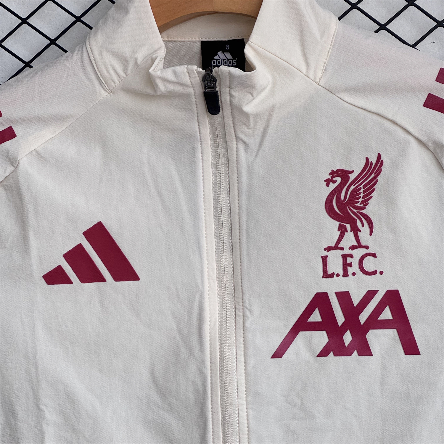 AlphaJersey-Liver.pool 25-26 Hooded Windbreaker Training Set - Cream Top & Black Pants