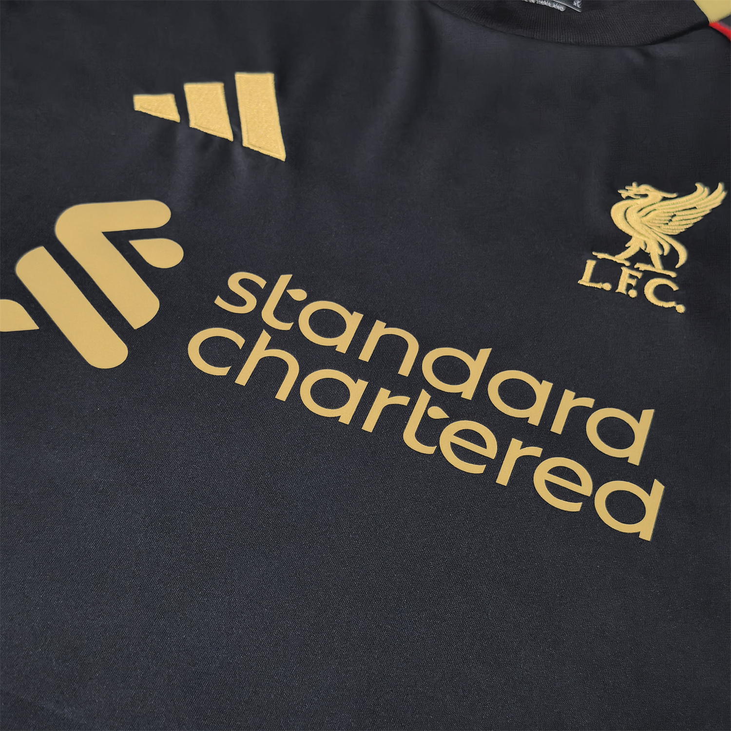 AlphaJersey-Liver.pool 25-26 Black Gold Special Jersey with Red Lines - Fans Version