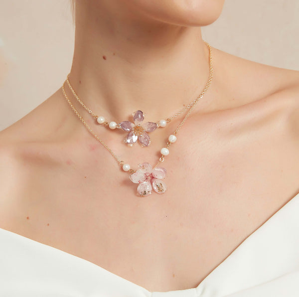 Cherry blossoms symbolize fleeting beauty and the transience of life. These cherry blossom necklace capture that symbolism, allowing you to carry the essence of springtime with you all year round. Features three types of cherry blossom flowers adorned