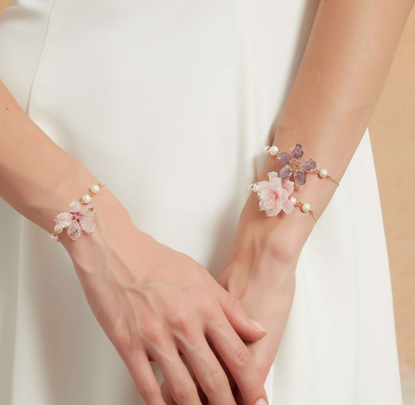 Cherry blossoms symbolize fleeting beauty and the transience of life. These cherry blossom bracelets capture that symbolism, allowing you to carry the essence of springtime with you all year round. Features three types of cherry blossom flowers adorned with freshwater pearls.