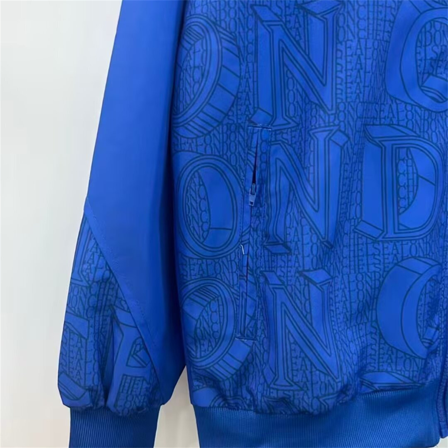 AlphaJersey-C.H.E.L.S.E.A 25-26 Subtle Letter Pattern Windbreaker Jacket - Blue