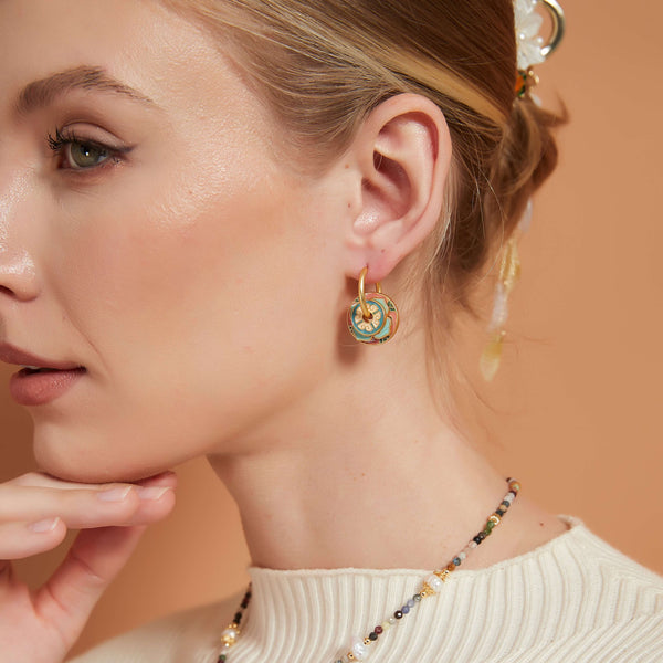 Discover the Enamel Flower Multiple Way Hoop Earrings, featuring three exquisite flower charms. Customize and assemble them in your unique style for a personalized touch. Versatile and chic, these earrings effortlessly blend elegance with creativity, perfect for any occasion. Express your individuality today!