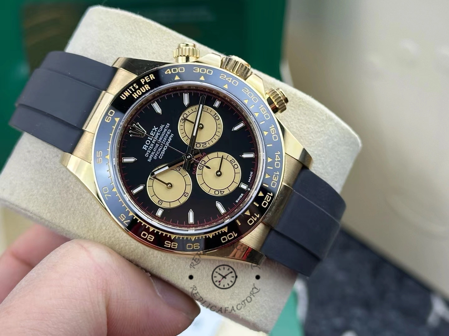 Side view of Rolex Daytona 126518LN held in hand showing detailed chronograph layout.