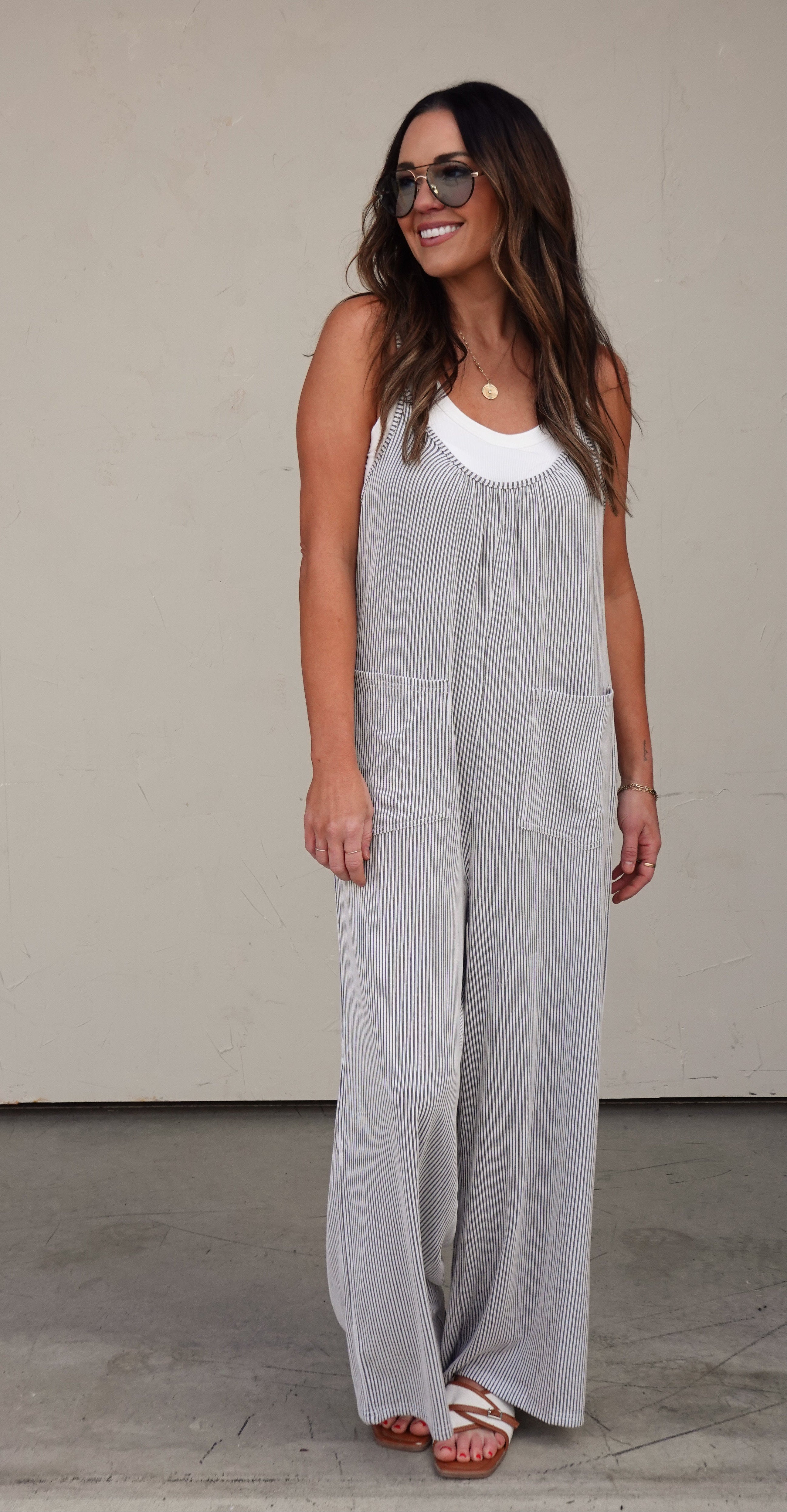 Pinstripe Sleeveless Slouchy Jumpsuit | Elegant Women's Fashion by coolavocek