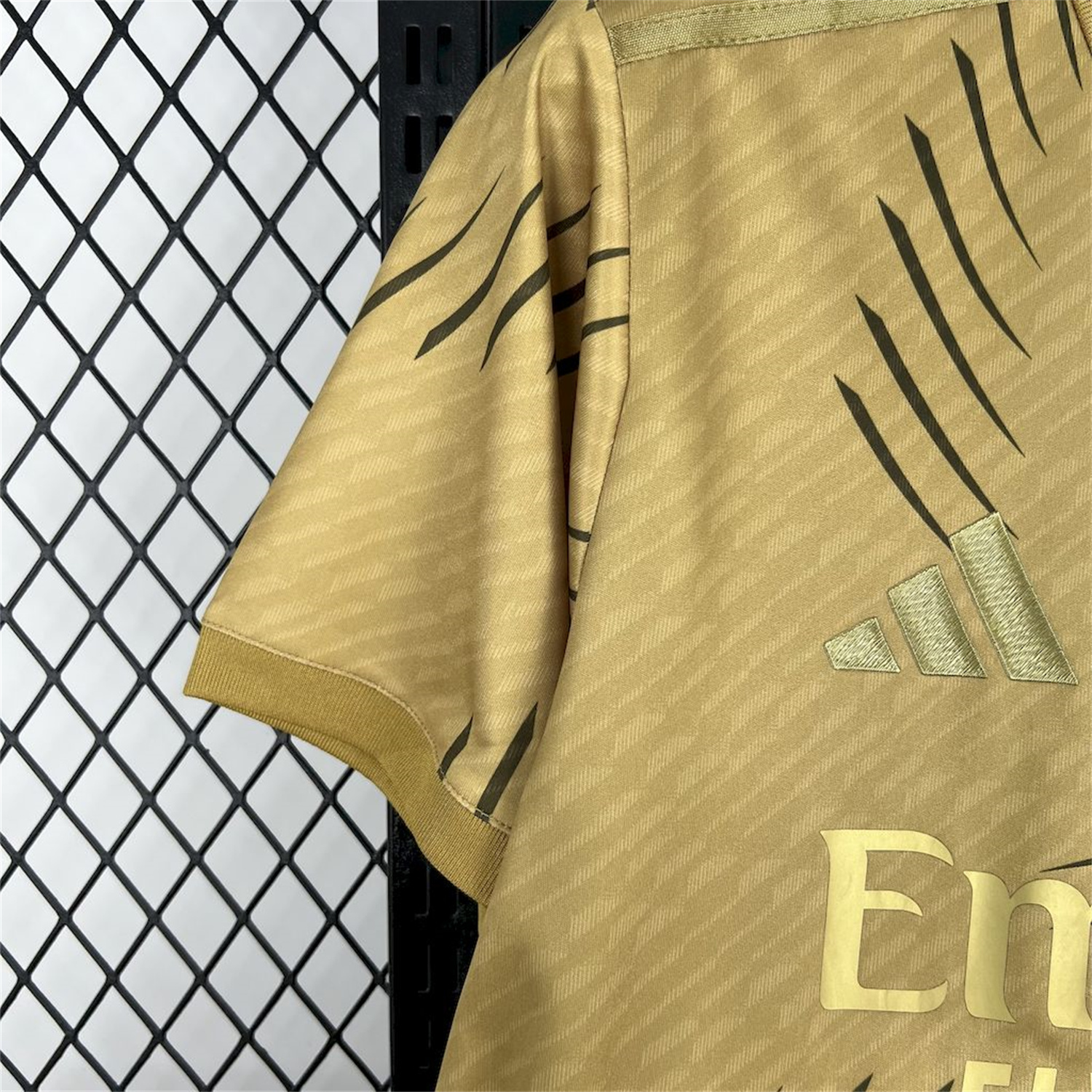 AlphaJersey-Real Madrid 25-26 Gold Swirl Training Jersey - Fans Version