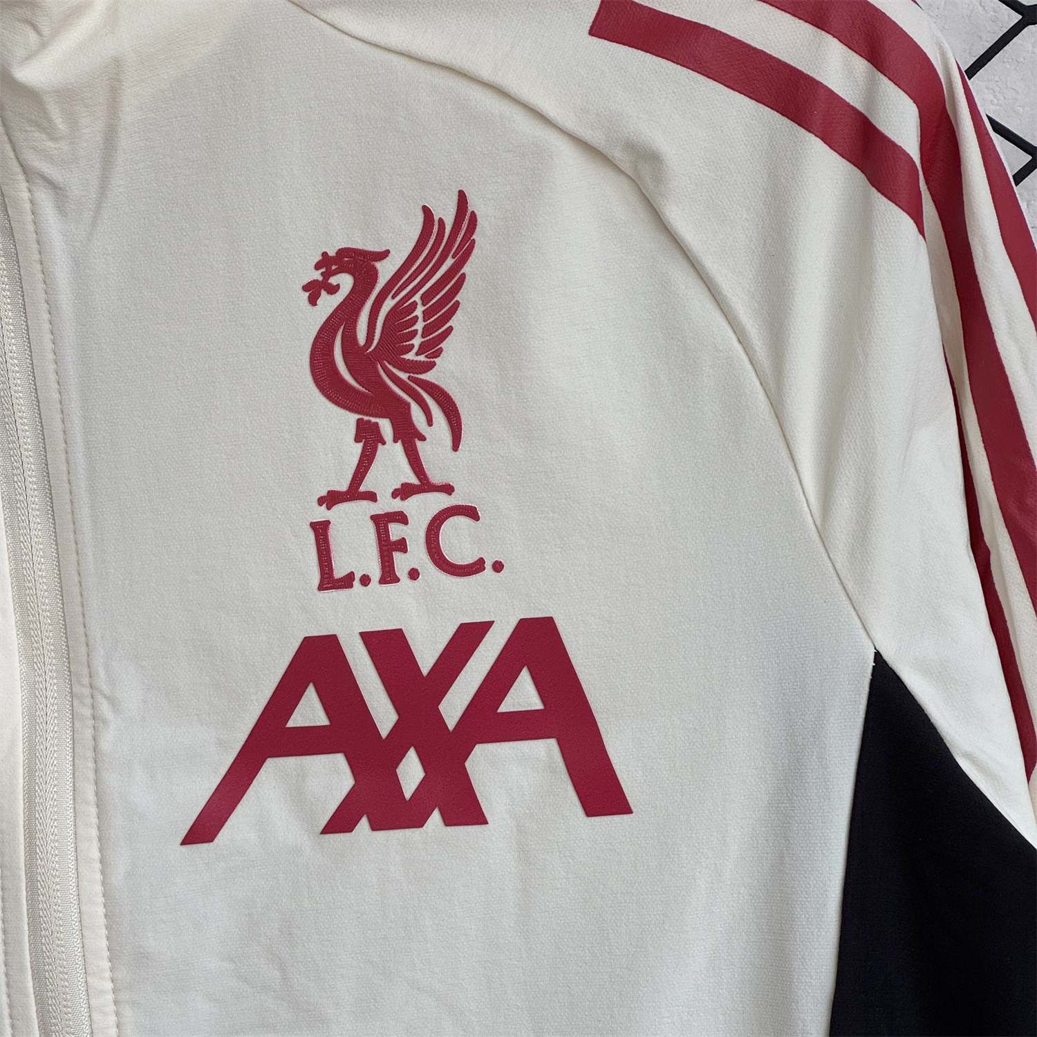 AlphaJersey-Liver.pool 25-26 Hooded Windbreaker Training Set - Cream Top & Black Pants
