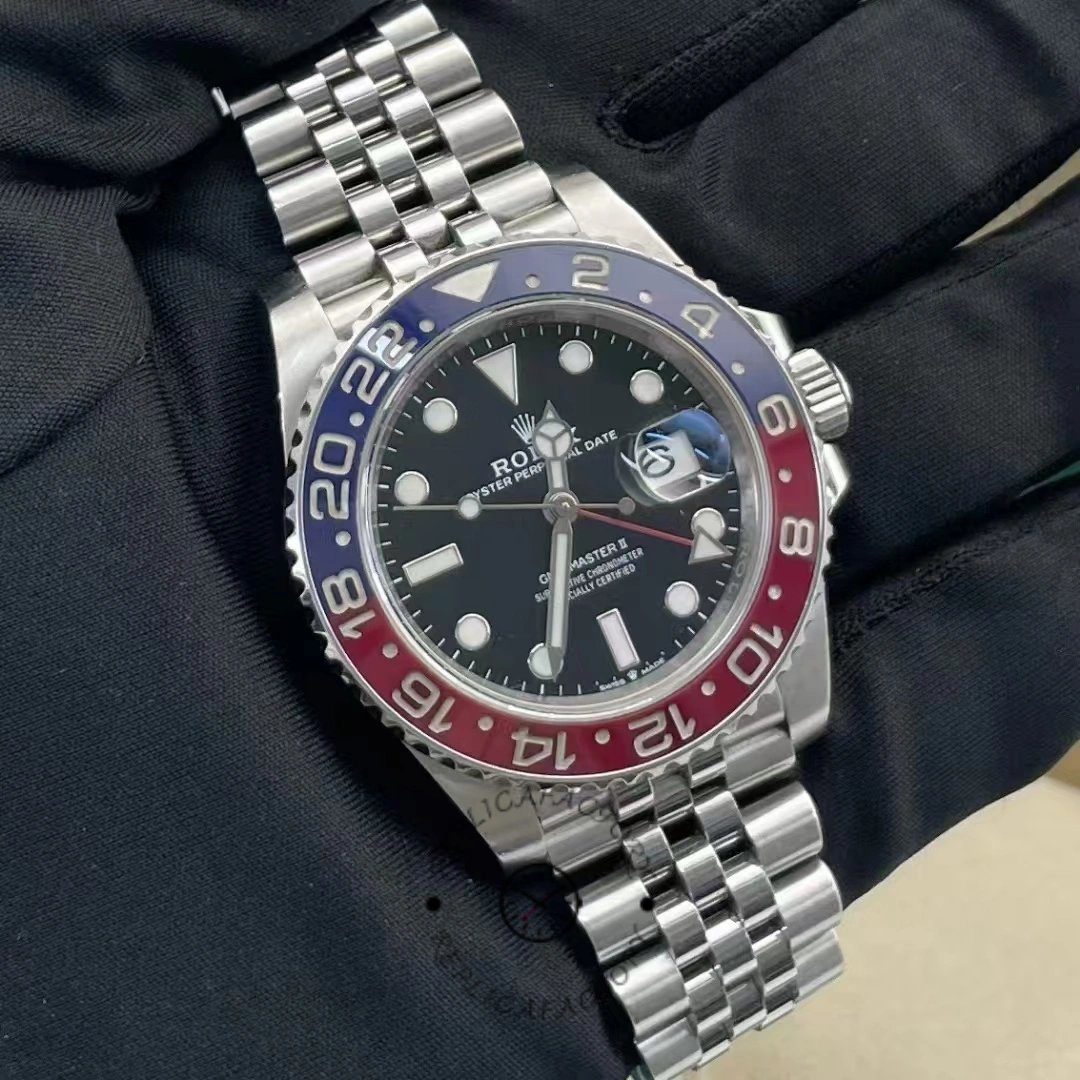 Pre-owned Rolex GMT-Master II 126710BLRO showing black dial and Pepsi bezel on Jubilee bracelet.