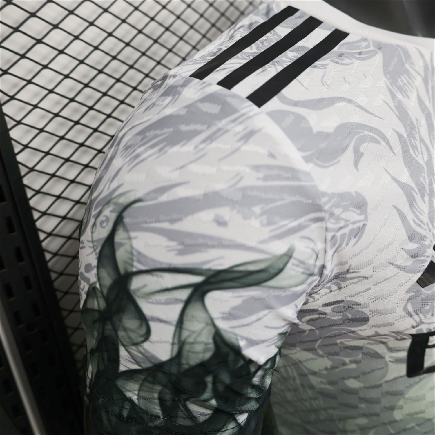 AlphaJersey-Real Madrid 25-26 Black Green Dragon Soars White Jersey - Player Version