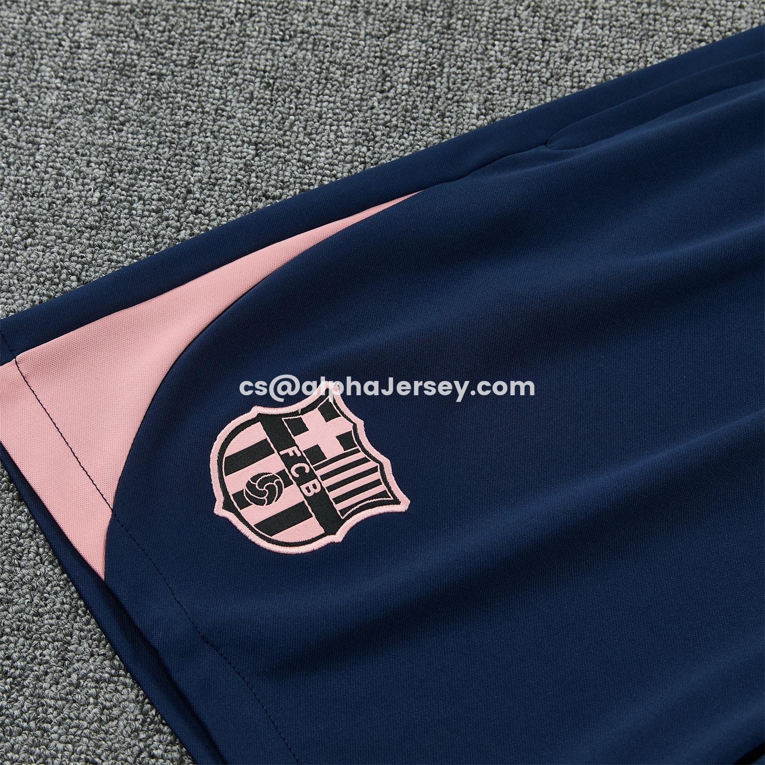 AJ-AlphaJersey-Barcelona 25-26 Short-Sleeve Training Set - Colors Top & Dark Blue With A Small Pink Detail Pants