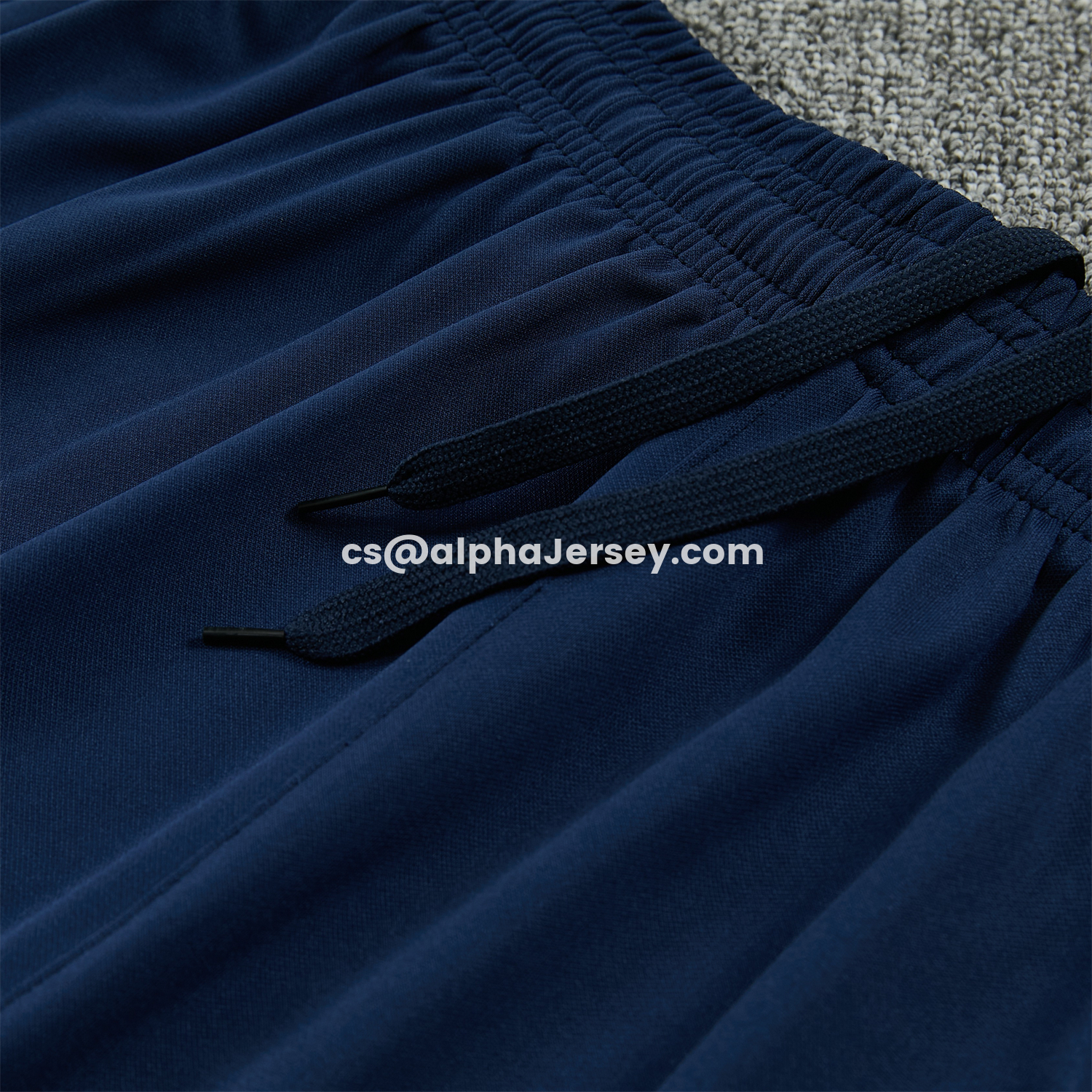 AJ-AlphaJersey-Barcelona 25-26 Short-Sleeve Training Set - Colors Top & Dark Blue With A Small Pink Detail Pants